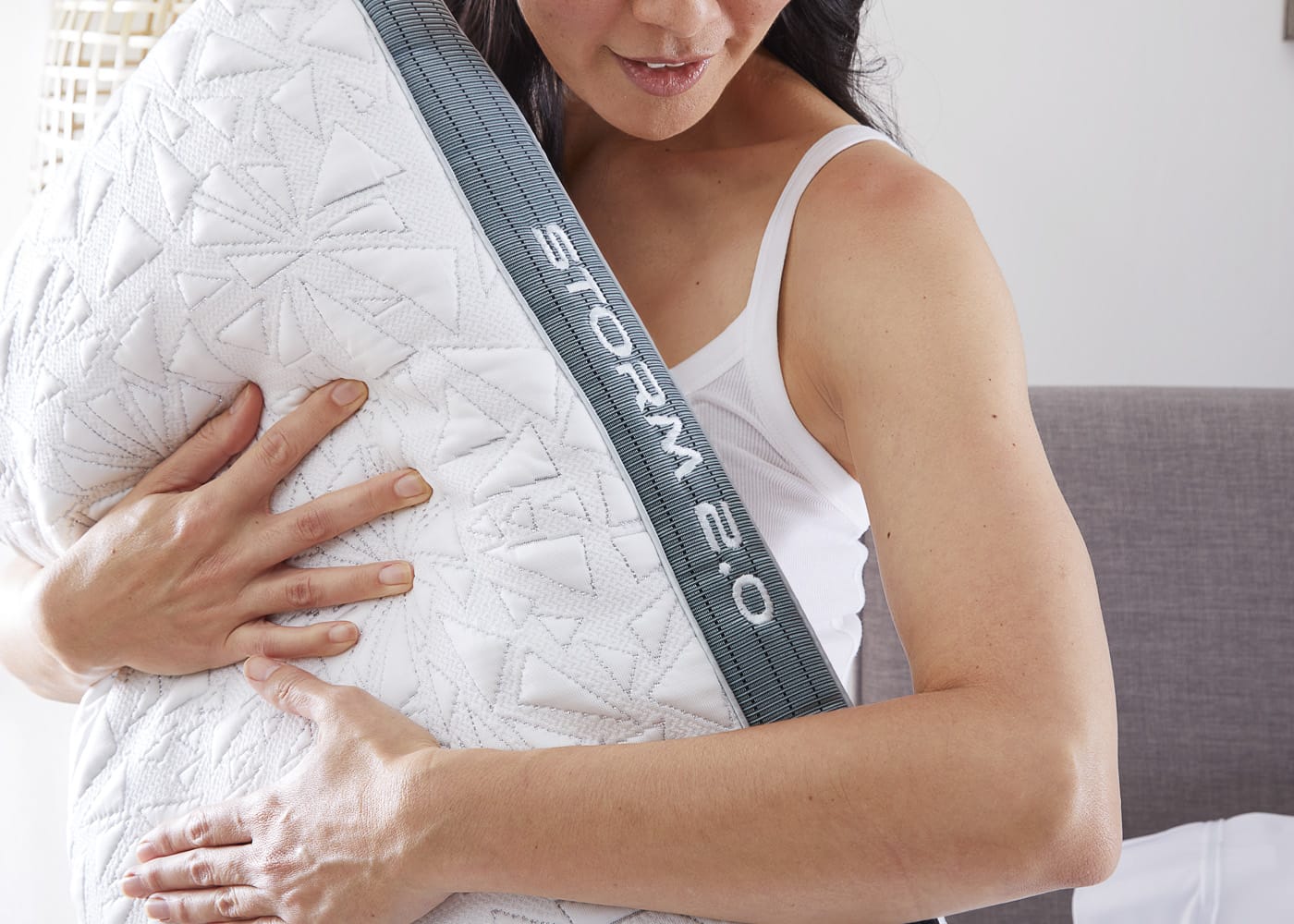 Woman Hugging the Bedgear Storm 2.0 Pillow